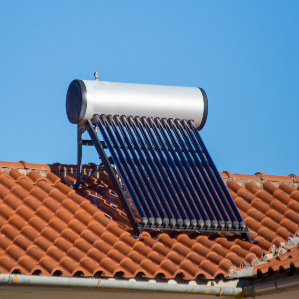 Solar water heater installed on roof of house